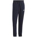 Spodnie męskie adidas Essentials Tapered Cuff 3 Stripes Pants granatowe GK8981